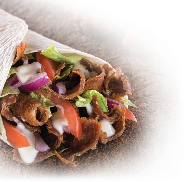 Donair with meat, lettuce, tomatoes and red onions